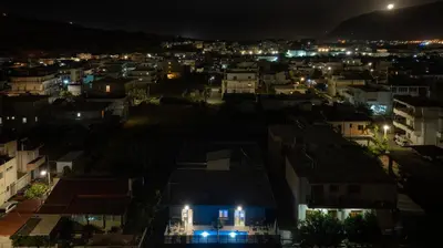 a view of a city at night at 7thHeaven Luxury aprts in Chania Town