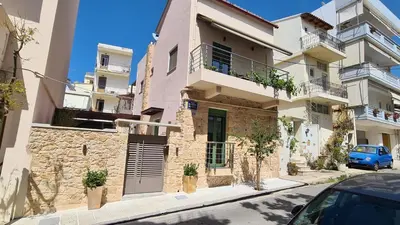 a building with a car parked in front of it at Casa Enetiko in Chania Town