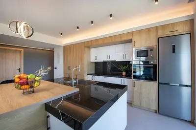 a kitchen with a bowl of fruit on a counter at Arithea Villa in Chania Town