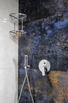 a shower in a room with a wall at Mariam Luxury Apartments in Chania Town