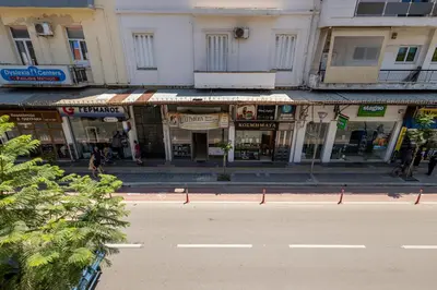 an empty street in a city with buildings at Central Bliss Apartment in Chania Town