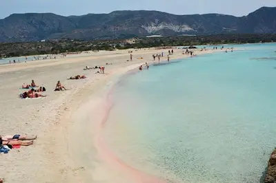 a group of people on a beach in the water at VALENA COZY MAISONETTE (15 min-ELAFONISI BEACH) in Élos
