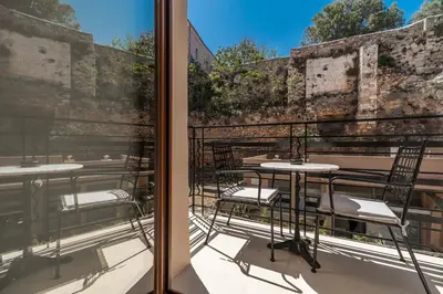a view from a balcony with tables and chairs at MiraVita Boutique Hotel - Adults Only in Chania Town