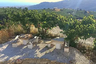 a group of benches sitting on top of a hill at Mulberry Hill - amazing panoramic views - Kissamos in Kissamos