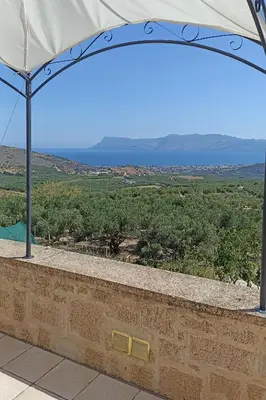 a stone wall with a view of a field at Mulberry Hill - amazing panoramic views - Kissamos in Kissamos