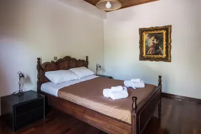 a bedroom with a bed with two towels on it at Liza's Place in Metókhion
