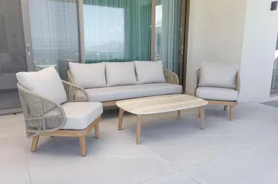 a living room with a couch and two chairs and a coffee table at Virtus in Mare in Tsivarás