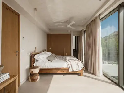 a bedroom with a bed and a large window at Villa Albero - Sea View Escape in Souda