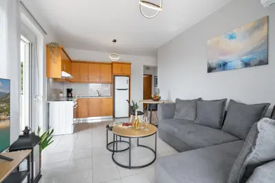 a living room with a couch and a table at Aelia Sea View in Chania Town