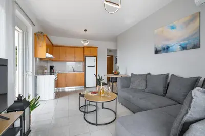 a living room with a couch and a table at Aelia Sea View in Chania Town