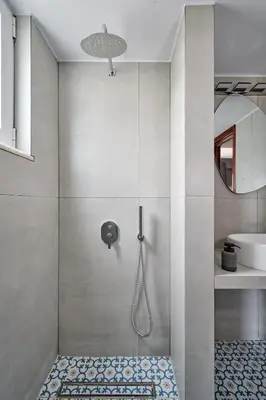 a bathroom with a shower with a glass door at Mons Villa in Kalathas