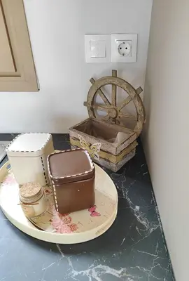 a plate with a chocolate cake and a wheel on a counter at Coastal Haven Your Oasis by the Sea in Análipsis