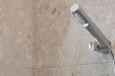 a shower head with water coming out of it at Casa Αrezio in Chania Town