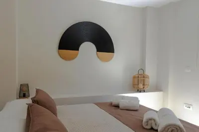 a bedroom with a bed with a moustache on the wall at Upper View Villa, with private pool in Chania Town
