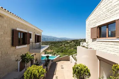 a villa with a view of the swimming pool at Upper View Villa, with private pool in Chania Town