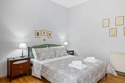 a bedroom with a bed with two towels on it at Artistic Apartment in Chania in Chania Town