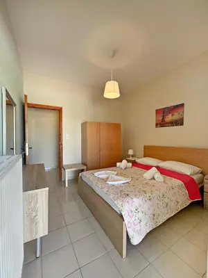 a bedroom with a large bed in a room at Villa Marianna Lygides in Ayiá