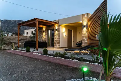 a house in the desert with a pergola at Holy Sea Smart Suites in Elafonisi