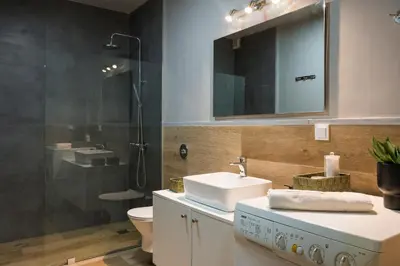 a bathroom with a sink and a shower at Natura Hill Villa I Sea View in Kounoupidhianá