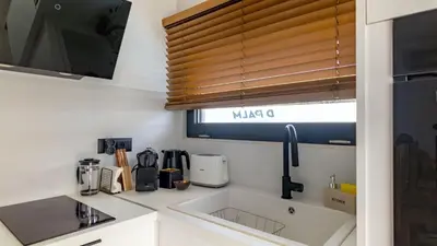 a small kitchen with a sink and a window at D PALM Premium Living - Kalathas, Chania in Chania Town