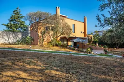a house with a yard in front of it at Lithos Serenity in Argoulidhés