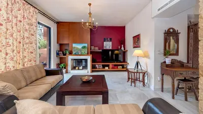 a living room with a couch and a table at Lithos Serenity in Argoulidhés