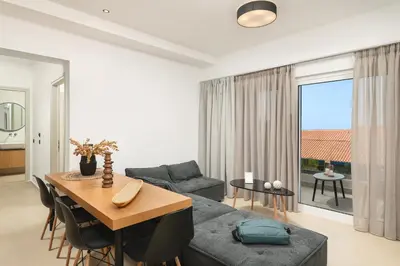a living room with a couch and a table at Elia City Apartments in Chania Town