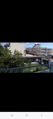 a view of a city with buildings and trees at Poppy Beloni in Chania Town
