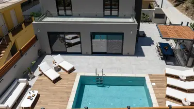 an overhead view of a swimming pool on a house at Tersus Luxury Villa in Kalyves