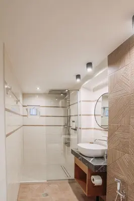 a bathroom with a sink and a shower at Santa Lucia - Cozy City Studio in Central Chania in Chania Town