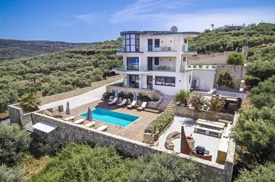 an aerial view of a house with a swimming pool at Naruto Villas in Kissamos