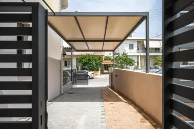 a hallway of a house with awning over a sidewalk at Clio - Newly renovated Home with Parking in Chania Town