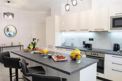 a kitchen with a table with fruit on it at Benessere in Chania Town