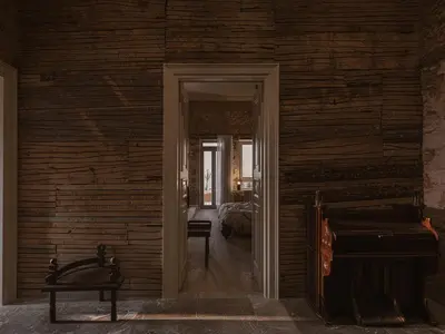 an open door into a room with a bedroom at Aisha Hotel in Chania Town