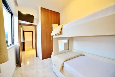 a bedroom with a bunk bed and a hallway at Anatoli Apartment in Kissamos