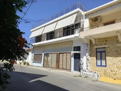 a building with solar panels on the roof at Anatoli Apartment in Kissamos