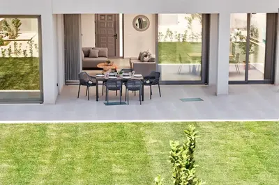two pictures of a patio with a table and chairs at Beach Sand Villas - Beachfront Roof Pool Seaviews in Pírgos Psilonérou