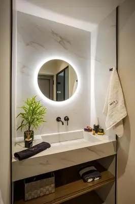 a bathroom with a sink and a mirror at Iria Sea View Room in Kolymvari