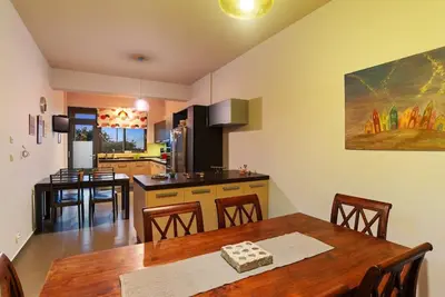 a kitchen and dining room with a table and chairs at Dream's House - Villa with Pool & Stunning Views in Daratso