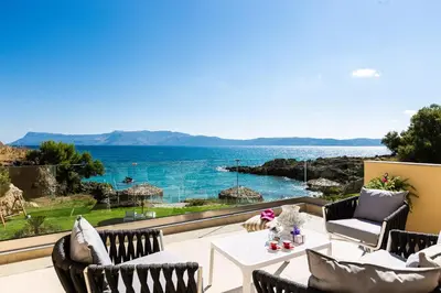 a patio with a view of the ocean at Harmony Villa in Chania Town