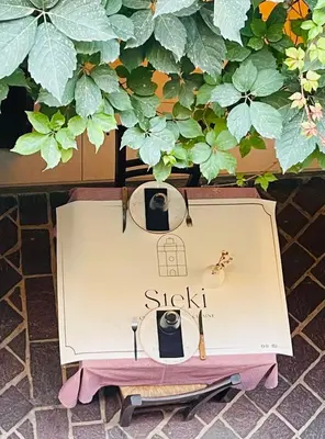 a dresser with two glasses and a table with at Steki Luxury Room 2 in Chania Town
