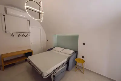 a hospital room with a bed and a chalkboard at ARCH HOME, luxury property with private parking in Chania Town