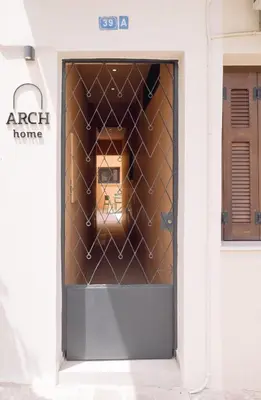 a door in a building with a box in it at ARCH HOME, luxury property with private parking in Chania Town