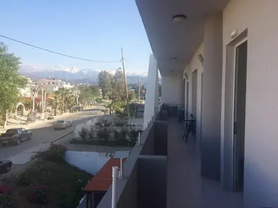 a balcony of a building with a view of a street at Posto studio 3 Chania Crete 100m from the beach in Daratso