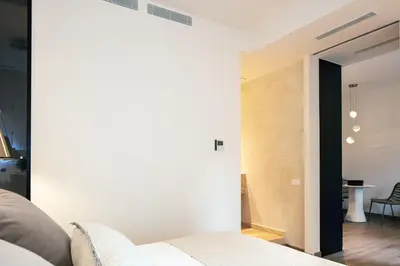 a living room with a couch and a table at Sea Path I Chania City Center luxury Suites in Chania Town