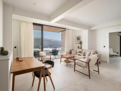 a living room with a couch and a table at Nemia Luxury Residence in Chania Town