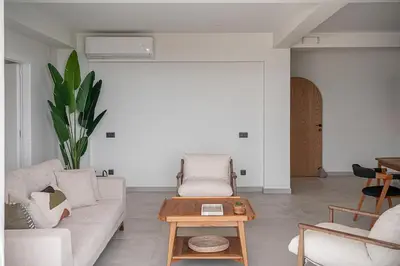 a living room with a couch and a table at Nemia Luxury Residence in Chania Town