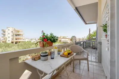 a balcony with a table with fruit on it at Maestro House in Chania Town