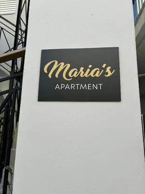 a sign for a marias appointment on the side of a building at Marias Apartment in Chania Town