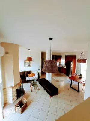 a living room with a couch and a table at Sonema Seaside Apt in Chania Town